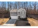 Charming two-story home featuring a two-car garage, and a well-manicured front yard at 4770 Alford Commons, Cumming, GA 30028