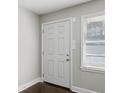 Interior entryway with white door and dark hardwood floors at 3563 Bolfair Nw Dr, Atlanta, GA 30331
