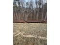 Residential land showing trees and a safety fence in a planned community at 319 Willam Gossett Dr, Canton, GA 30114