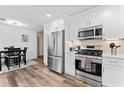 Modern kitchen with stainless steel appliances and white shaker cabinets at 188 Brandon Ridge Cir, Stockbridge, GA 30281