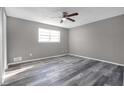 Spacious bedroom with grey walls and wood-look floors at 4701 Flat Shoals Rd # 49C, Union City, GA 30291