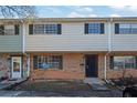 Front view of a brick townhouse with a satellite dish at 4701 Flat Shoals Rd # 49C, Union City, GA 30291