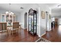 Formal dining room with hardwood floors, chandelier, and built-in hutch at 121 Meridian Dr, Woodstock, GA 30188