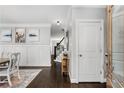 Bright and airy entryway with hardwood floors and elegant wall paneling at 1617 Gilstrap Nw Ln, Atlanta, GA 30318