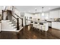 Modern kitchen featuring white cabinets, granite countertops, and a large island at 1617 Gilstrap Nw Ln, Atlanta, GA 30318