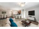 Bright and airy living room with open floor plan and kitchen at 400 17Th Nw St # 2213, Atlanta, GA 30363