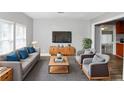 Inviting living room featuring a comfortable couch, armchairs, and modern decor at 2222 Mcafee Rd, Decatur, GA 30032