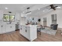 Open concept kitchen with island, white cabinets and stainless steel appliances at 2645 Shadow Woods Ne Cir, Marietta, GA 30062