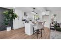 Stylish kitchen with white cabinets, modern appliances, and a chic center island at 2645 Shadow Woods Ne Cir, Marietta, GA 30062