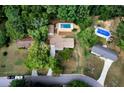 Aerial view showing property, pool, and neighborhood at 4770 Shady Rest Dr, Powder Springs, GA 30127