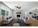 Bright living room with fireplace and hardwood floors at 4770 Shady Rest Dr, Powder Springs, GA 30127