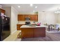 Eat-in kitchen with island and dark wood cabinets at 2916 Hillside Pl, Decatur, GA 30034