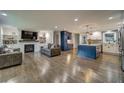 Open concept kitchen with white and blue cabinetry, island, and hardwood floors at 2439 Woodridge Dr, Decatur, GA 30033