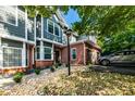 Attractive two-story townhome with gray siding, brick accents, and a landscaped front yard at 2680 Pine Tree Ne Rd # 2, Atlanta, GA 30324