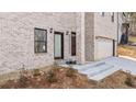 Front entrance with steps leading to double doors at 4420 Ross Estates Ct, Snellville, GA 30039