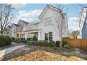 Two-story house with light gray siding, front porch, and landscaping at 3216 Colchester St, Douglasville, GA 30135