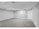 Unfinished basement with neutral-colored walls and concrete flooring at 2234 Cherokee Valley Dr, Lithonia, GA 30058