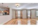 Hardwood floor living room with kitchen passthrough at 2790 Laurel Valley Trl, Buford, GA 30519