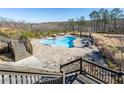 Inviting pool with spacious patio and wooded views at 1150 Brushy Mountain Rd, Rockmart, GA 30153