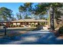Ranch house with attached garage and driveway at 750 Skipper Dr, Atlanta, GA 30318