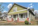 Green sided two-story duplex home with a spacious front porch at 1177 Arlington Ave, Atlanta, GA 30310