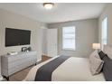 Bright bedroom with a king-size bed, dresser, and ample natural light at 1177 Arlington Ave, Atlanta, GA 30310