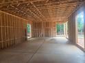 Spacious basement featuring concrete flooring and wood framing for future customization at 120 Cedarwood Ln, Roswell, GA 30075
