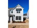 Stunning two-story townhome with gray siding and black shutters at 1814 Emory Ln # 92, Conyers, GA 30013