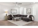 Comfortable living room with a plush sectional sofa, area rug, and modern art at 396 Pratt Se Dr # 1932, Atlanta, GA 30315