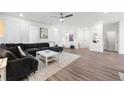 Spacious living room with large sectional sofa, neutral decor, and abundant natural light at 396 Pratt Se Dr # 1932, Atlanta, GA 30315