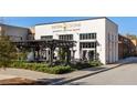 Exterior view of Patria Cocina, a modern restaurant with outdoor seating at 396 Pratt Se Dr # 1932, Atlanta, GA 30315