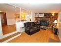 Relaxing living room with a stone fireplace and leather recliner at 4038 Wesley Chapel Rd, Marietta, GA 30062