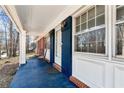 Inviting front porch with blue accents and a charming sitting area at 3880 Admiral Dr, Atlanta, GA 30341