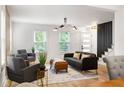 Bright living room with hardwood floors, comfortable seating, and large windows at 126 Marona Ne St, Atlanta, GA 30307