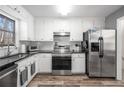 Modern kitchen with stainless steel appliances and granite countertops at 257 Rock Garden Nw Ter, Marietta, GA 30064