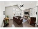 Spacious living room with stone fireplace, built-in shelving, and hardwood floors at 191 Foxtail Rd, Woodstock, GA 30188