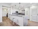 Modern white kitchen with marble countertops and stainless steel appliances at 2795 Peachtree Rd # 1305, Atlanta, GA 30305