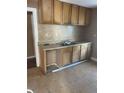 Kitchen with double sink and light brown cabinets at 708 South Ave, Forest Park, GA 30297