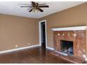 Living room with hardwood floors and fireplace at 708 South Ave, Forest Park, GA 30297