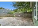 Private backyard with a paved patio and wooden fence at 490 Rockwell Sw St, Atlanta, GA 30310