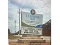 Sign for E.E. Robinson Park, featuring contact information and announcements for local football and cheerleading programs at 6935 Melody Dr, Buford, GA 30518