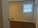 Bright bedroom with brown carpet and a window at 10650 Panhandle Rd, Hampton, GA 30228