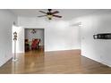 Open living room with hardwood floors and dining area at 1468 Briarwood Ne Rd # 1307, Brookhaven, GA 30319