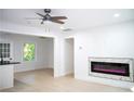 Bright living room with modern fireplace and hardwood floors at 1807 W Austin Rd, Decatur, GA 30032