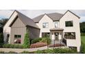 Charming exterior showcasing the front of this beautiful two-story home and manicured landscaping at 3680 Tanglewood Se Dr, Atlanta, GA 30339