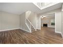 Spacious living room with hardwood floors and fireplace at 7124 Big Woods Dr, Woodstock, GA 30189