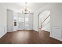 Formal dining room featuring hardwood floors and wainscoting at 221 Cutbank Sw Ct, Atlanta, GA 30331