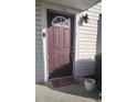 Exterior burgundy front door with a welcome mat at 1625 Conley Rd # 138, Conley, GA 30288