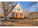 Side view of house highlighting the garage at 2216 Mcdaniel Mill Sw Rd, Conyers, GA 30094