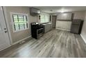 Renovated kitchen with stainless steel appliances and gray cabinets at 2308 Lakewood Sw Ave, Atlanta, GA 30315